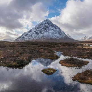 Winter landscape image of River Etive iconic snowcapped Stob Dearg Buachaille Etive Mor mountain